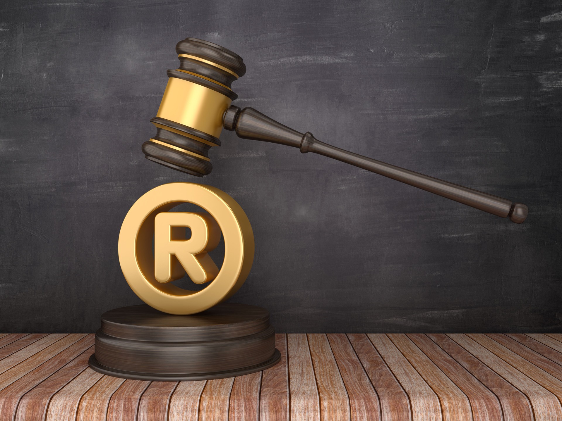 Gavel with Registered Trademark Symbol on Chalkboard Background - 3D Rendering